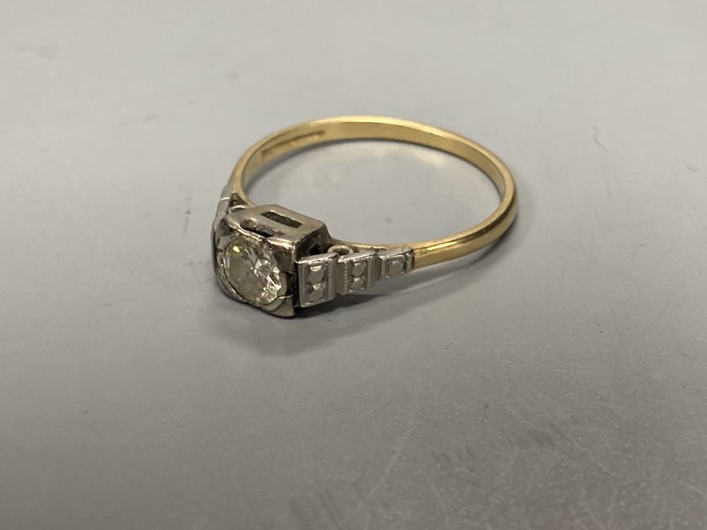 An early 20th century 18ct and solitaire diamond ring, size M/N, gross 2.3 grams.